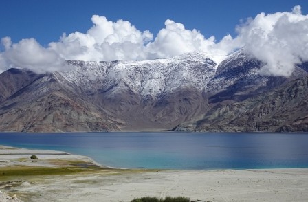 Leh-Ladakh is the place to go. It has rough land, peaceful buildings where monks live.